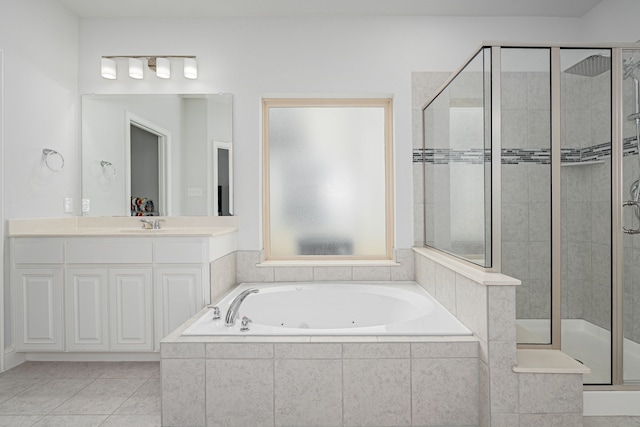 full bath featuring a tub with jets, a shower stall, tile patterned floors, and vanity