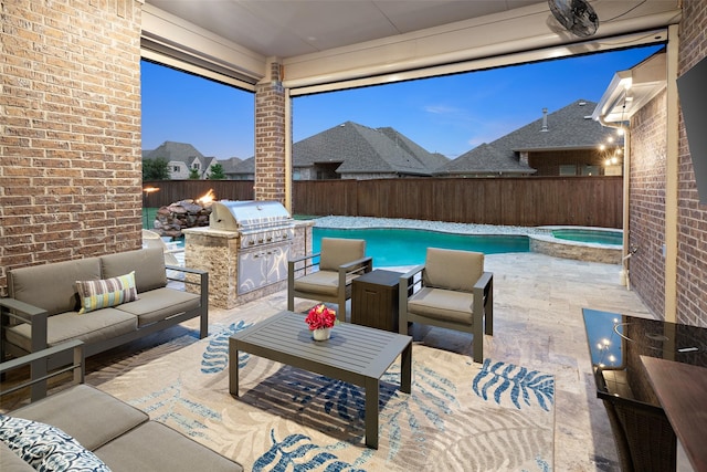 view of patio / terrace featuring exterior kitchen, a pool with connected hot tub, outdoor lounge area, and a fenced backyard