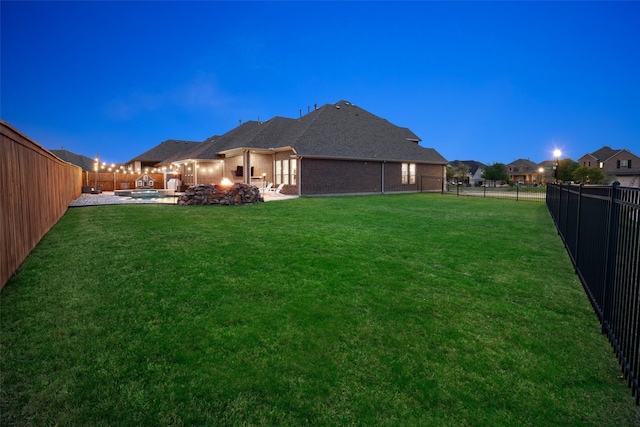 view of yard with a patio and a fenced backyard