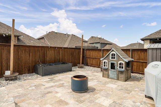 view of patio / terrace featuring a fenced backyard and a vegetable garden
