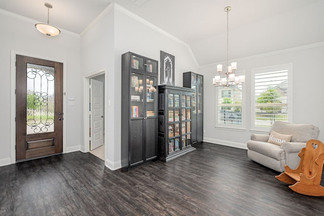 foyer featuring crown molding, baseboards, dark wood finished floors, and a notable chandelier