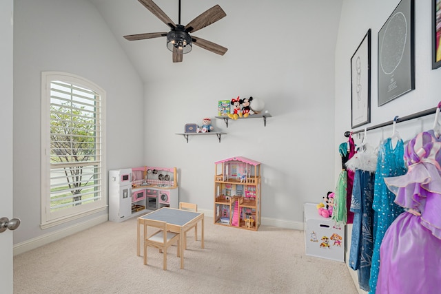 playroom with carpet floors, ceiling fan, baseboards, and lofted ceiling