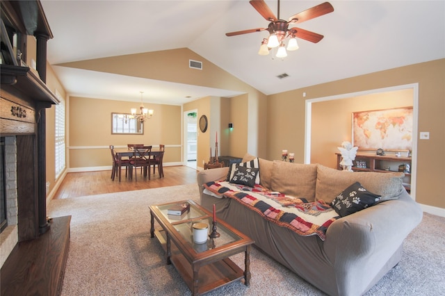 carpeted living area with a brick fireplace, baseboards, lofted ceiling, and visible vents