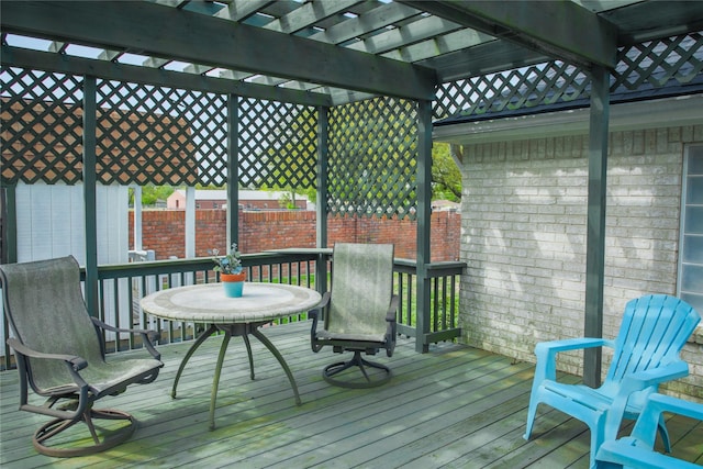 deck with a pergola and fence