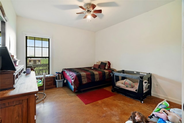 bedroom featuring baseboards and a ceiling fan