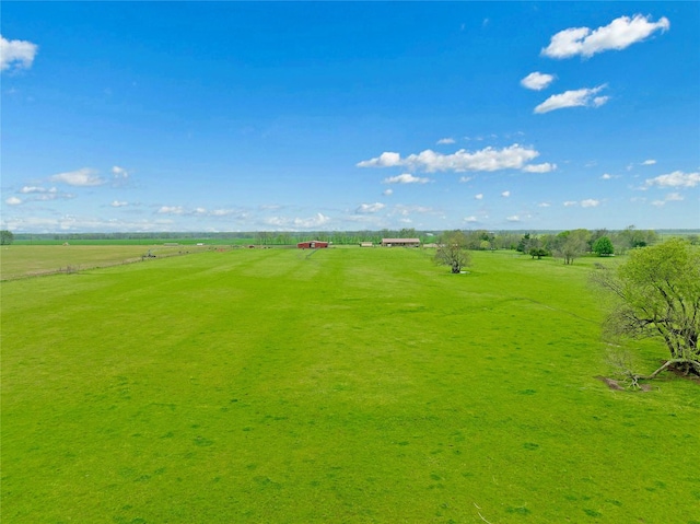 birds eye view of property featuring a rural view