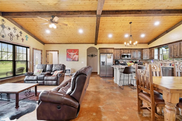living room featuring vaulted ceiling with beams, wooden ceiling, concrete floors, and ceiling fan with notable chandelier