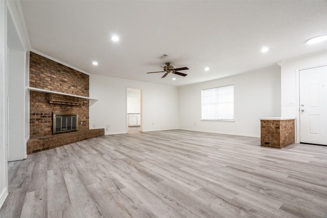 3100 E Park Blvd, Plano, TX 75074 - unfurnished living room with wood finished floors, ceiling fan, a fireplace, baseboards, and recessed lighting