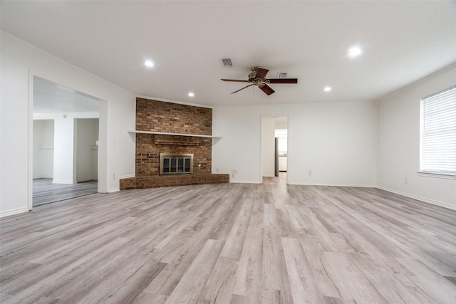 3100 E Park Blvd, Plano, TX 75074 - unfurnished living room featuring a ceiling fan, light wood-style flooring, recessed lighting, baseboards, and a brick fireplace