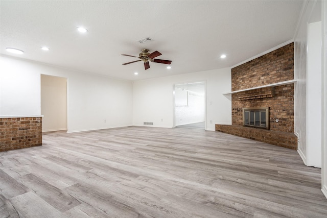 3100 E Park Blvd, Plano, TX 75074 - unfurnished living room featuring ceiling fan, light wood-style flooring, a fireplace, recessed lighting, and baseboards