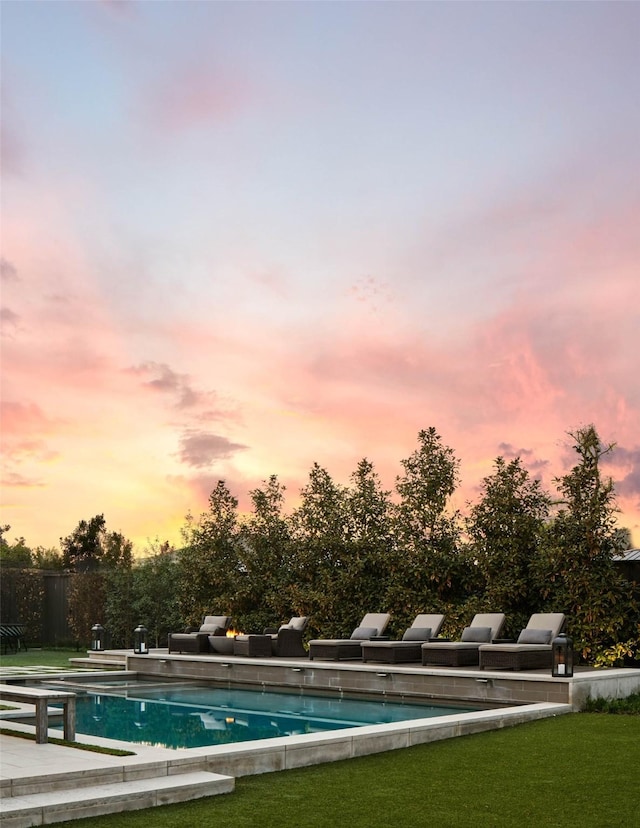 2205 Wheeler Dr, Southlake, TX 76092 - pool at dusk with a lawn