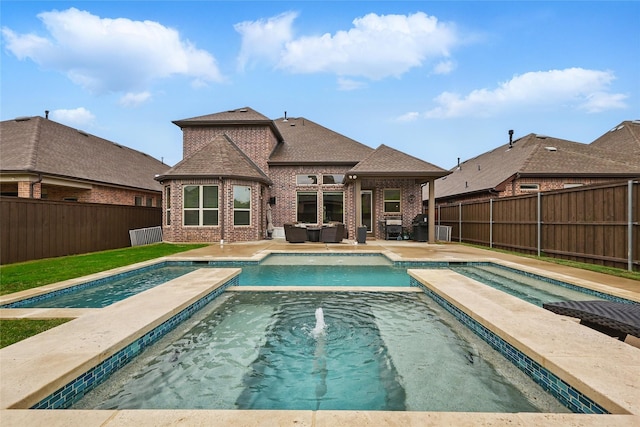 4940 Campbeltown Dr, Flower Mound, TX 75028 - view of pool featuring an outdoor hangout area, a patio, a pool with connected hot tub, and a fenced backyard
