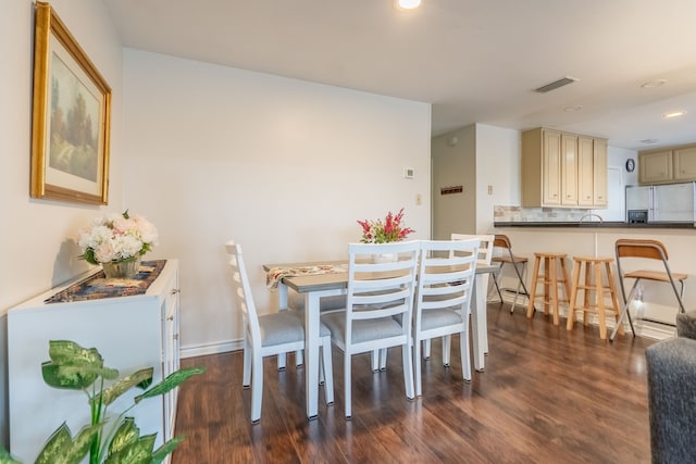 dining area with dark wood-style flooring, recessed lighting, baseboards, and visible vents