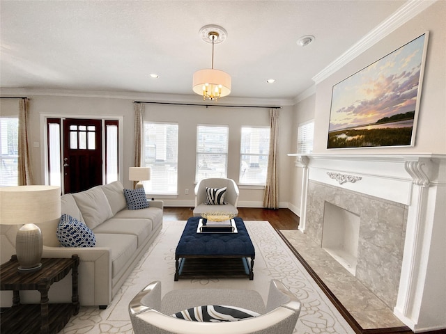 1217 Kings Hwy, Dallas, TX 75208 - living room with crown molding, wood finished floors, a fireplace, baseboards, and recessed lighting