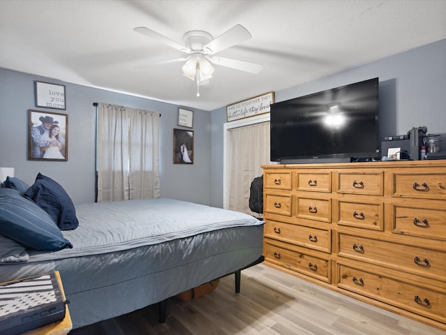 1306 Hulme St, Bowie, TX 76230 - bedroom with light wood-type flooring and ceiling fan