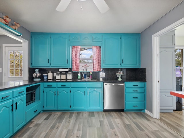 1306 Hulme St, Bowie, TX 76230 - kitchen featuring ceiling fan, stainless steel appliances, a sink, light wood-style floors, and backsplash