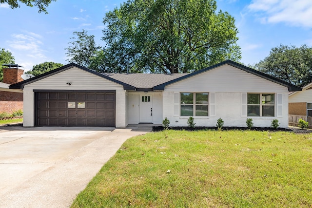 9056 Berkshire Dr, Frisco, TX 75033 - single story home featuring a garage, driveway, a front yard, and brick siding