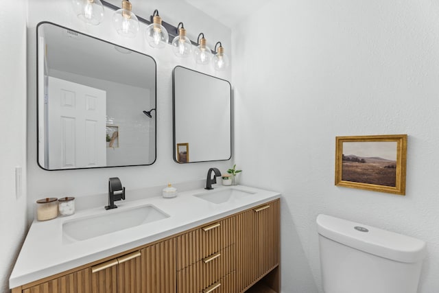 9056 Berkshire Dr, Frisco, TX 75033 - bathroom with toilet and double vanity