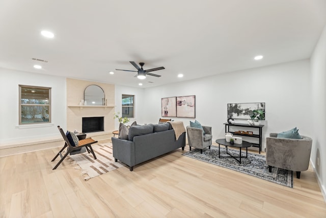 9056 Berkshire Dr, Frisco, TX 75033 - living area featuring ceiling fan, light wood-style floors, recessed lighting, a fireplace, and baseboards