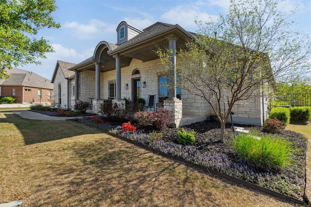 2602 Cypress Dr, Rockwall, TX 75087 - view of property exterior featuring a lawn, a porch, and stone siding
