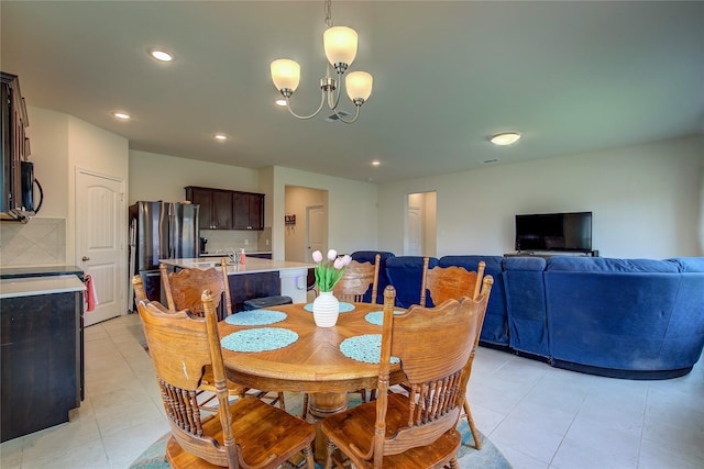 914 Edgar St, Greenville, TX 75401 - dining space featuring an inviting chandelier, light tile patterned floors, and recessed lighting