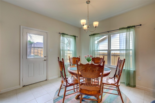 914 Edgar St, Greenville, TX 75401 - dining space featuring baseboards, a notable chandelier, and light tile patterned floors