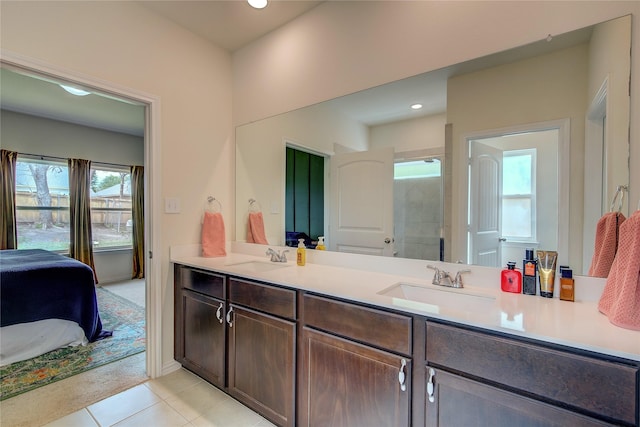 914 Edgar St, Greenville, TX 75401 - ensuite bathroom featuring a sink, ensuite bath, and a healthy amount of sunlight