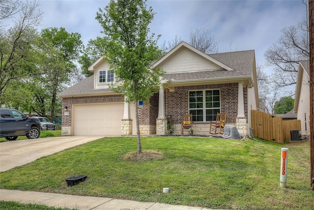914 Edgar St, Greenville, TX 75401 - view of front of home featuring stone siding, driveway, central air condition unit, and roof with shingles