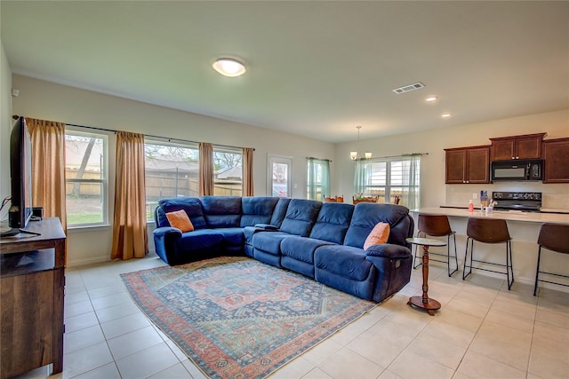914 Edgar St, Greenville, TX 75401 - living area with recessed lighting, an inviting chandelier, light tile patterned floors, baseboards, and visible vents