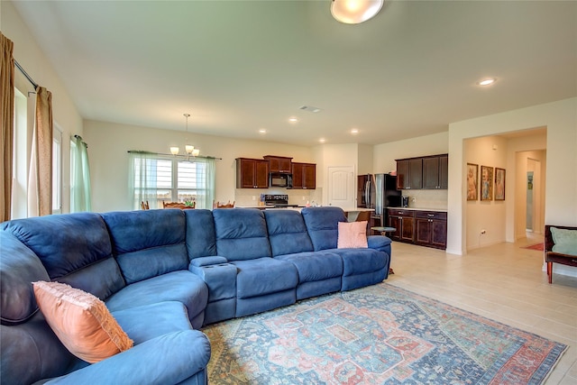914 Edgar St, Greenville, TX 75401 - living room with visible vents, light tile patterned floors, recessed lighting, and an inviting chandelier