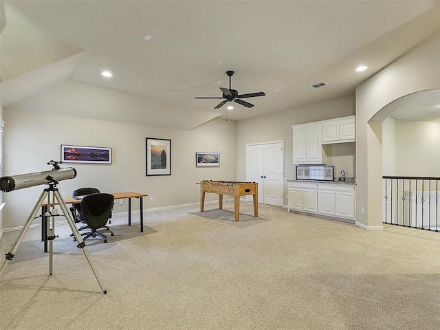 playroom featuring light carpet, visible vents, and baseboards