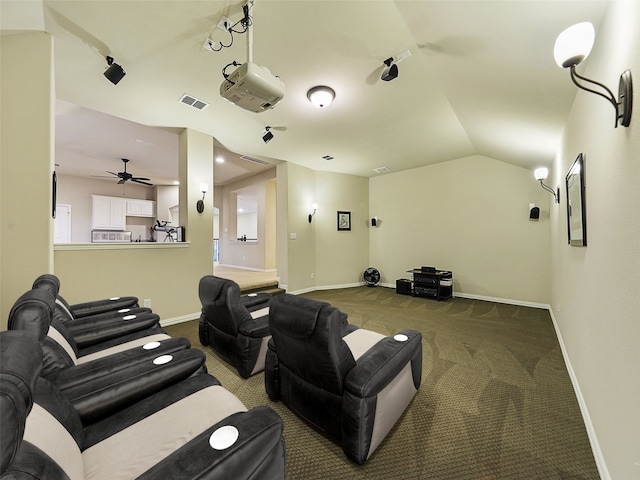 carpeted cinema featuring ceiling fan, baseboards, lofted ceiling, and visible vents