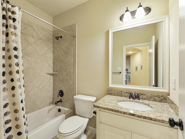 bathroom with shower / bath combination with curtain, vanity, toilet, a textured wall, and baseboards