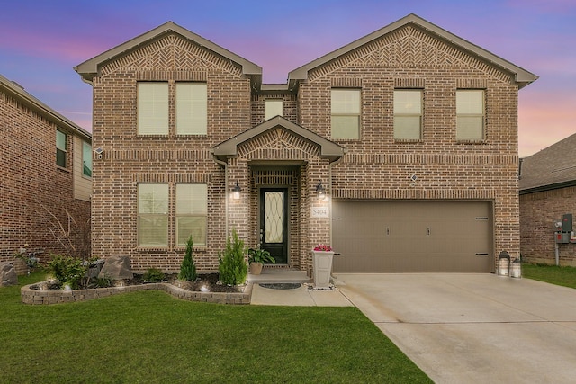 5404 Fairdale Dr, Denton, TX 76207 - view of front of home with brick siding, an attached garage, a front lawn, and concrete driveway