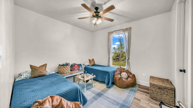 118 E Bay Dr, Bridgeport, TX 76426 - bedroom with ceiling fan, baseboards, and wood finished floors