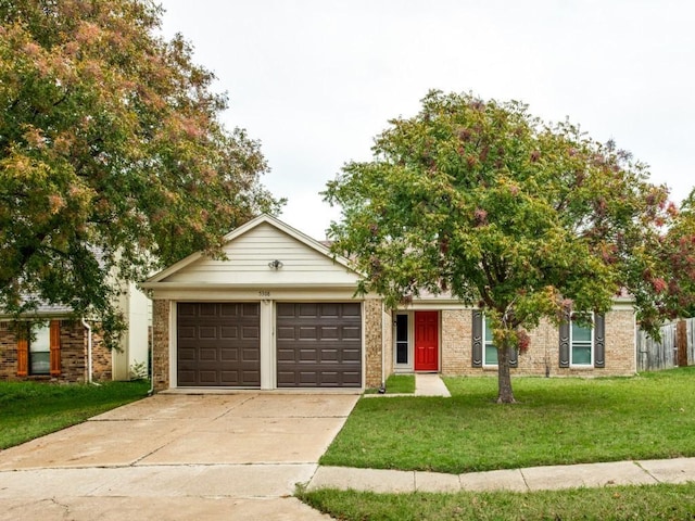view of front of home with brick siding, concrete driveway, a garage, and a front lawn