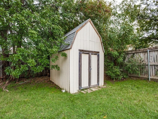 view of shed with fence