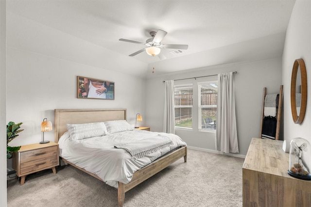 bedroom with light carpet, lofted ceiling, ceiling fan, and visible vents
