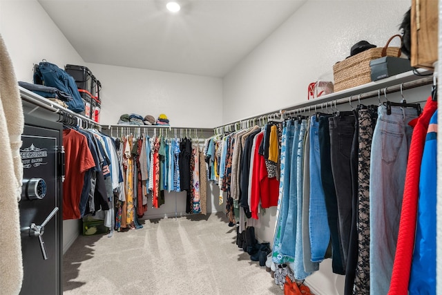 walk in closet featuring carpet flooring