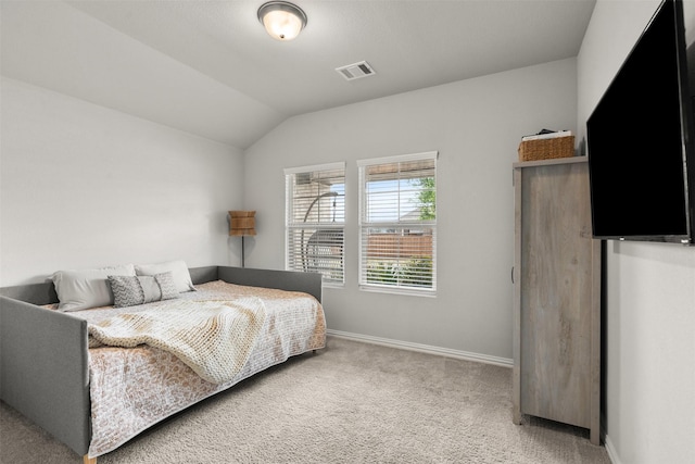 bedroom with light carpet, baseboards, lofted ceiling, and visible vents