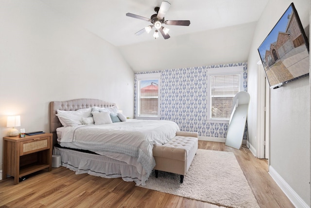 3968 Hunter Peak Rd, Fort Worth, TX 76262 - bedroom with lofted ceiling, light wood-style floors, wallpapered walls, and ceiling fan