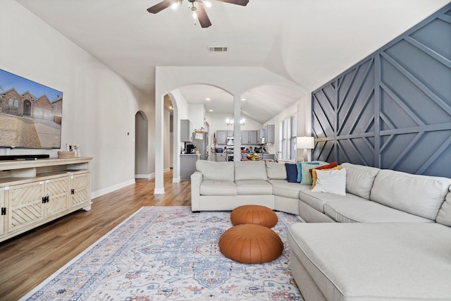 3968 Hunter Peak Rd, Fort Worth, TX 76262 - living room with arched walkways, a ceiling fan, light wood finished floors, lofted ceiling, and recessed lighting