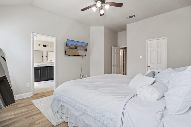 3968 Hunter Peak Rd, Fort Worth, TX 76262 - bedroom with light wood finished floors, connected bathroom, lofted ceiling, and a ceiling fan