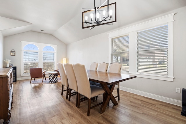 3968 Hunter Peak Rd, Fort Worth, TX 76262 - dining room featuring lofted ceiling, wood finished floors, and a chandelier