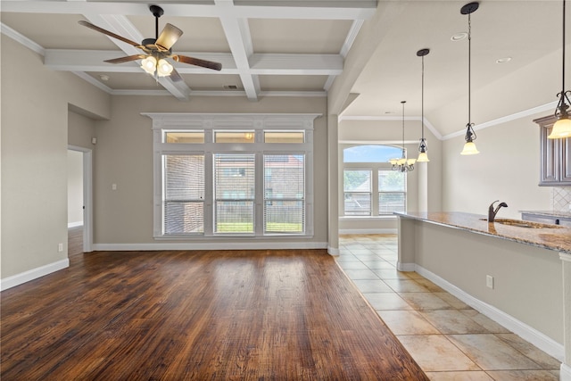 612 Buelwood Ct, Desoto, TX 75115 - kitchen with beam ceiling, baseboards, a sink, a chandelier, and a ceiling fan