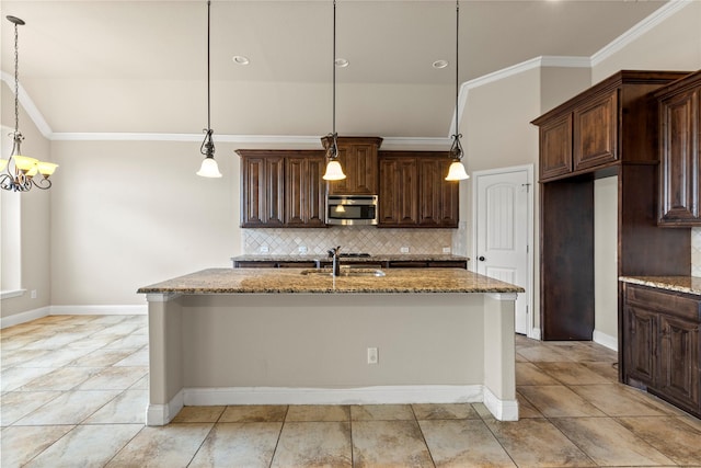 612 Buelwood Ct, Desoto, TX 75115 - kitchen featuring stainless steel microwave, backsplash, a sink, light stone countertops, and crown molding