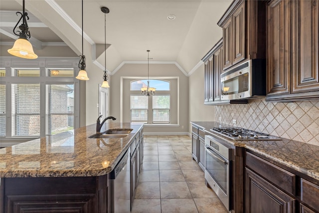 612 Buelwood Ct, Desoto, TX 75115 - kitchen with a sink, appliances with stainless steel finishes, decorative backsplash, vaulted ceiling, and baseboards