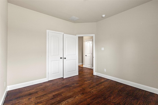 612 Buelwood Ct, Desoto, TX 75115 - unfurnished bedroom with dark wood finished floors and baseboards