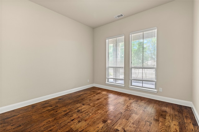 612 Buelwood Ct, Desoto, TX 75115 - spare room with baseboards and dark wood-type flooring