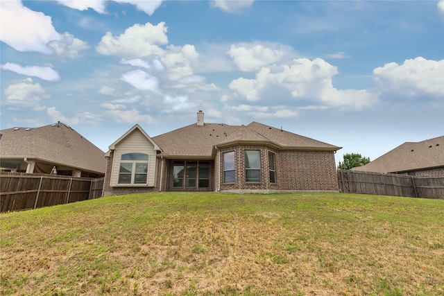 612 Buelwood Ct, Desoto, TX 75115 - rear view of house featuring brick siding and a fenced backyard